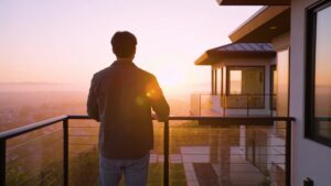 An individual embracing natural outdoor morning light at dawn to support healthy circadian rhythms and daily vitality.