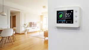 A modern smart thermostat interface mounted on a clean living room wall showing energy-efficient settings.