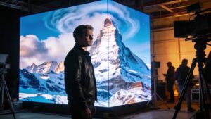 A modern virtual production studio utilizing an advanced LED wall to display a realistic digital background.