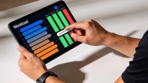 A sports scientist organizing an elite athlete's seasonal periodization calendar on a modern digital dashboard.