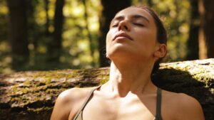 A person practicing breathwork in nature illustrating vagus nerve activation and stress regulation.