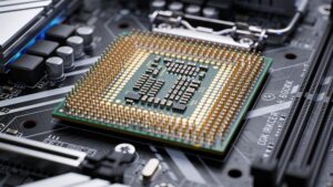 A high-performance neuromorphic edge computing chip mounted on a circuit board with liquid cooling pipes nearby.