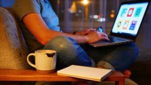 "Person browsing streaming app options on a laptop at night"