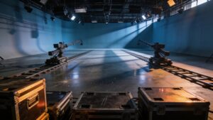"Empty film production set with lighting equipment, representing rising content production costs"