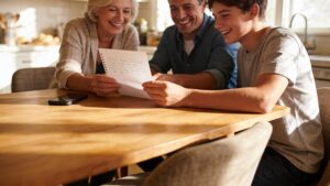Family around a kitchen table agreeing on a safe word together"
