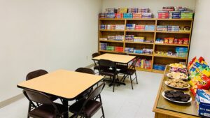 Room prepared with tables and snacks for a game night.